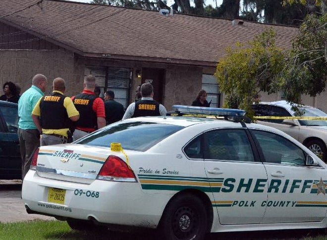 Polk County Sheriff's deputies secure the scene outside of 3041 St. Paul Drive in Winter Haven shortly after a fatal shooting took place on Tuesday.