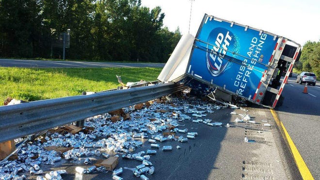 A truck carrying beer crashed this morning in Hernando County after its driver became distracted by his dog, according to the Florida Highway Patrol.
