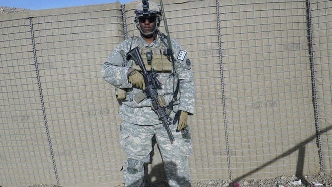 U.S. Army infantry squad leader Isiah James poses in Afghanistan during his third deployment between 2010 and 2011. (photo provided)