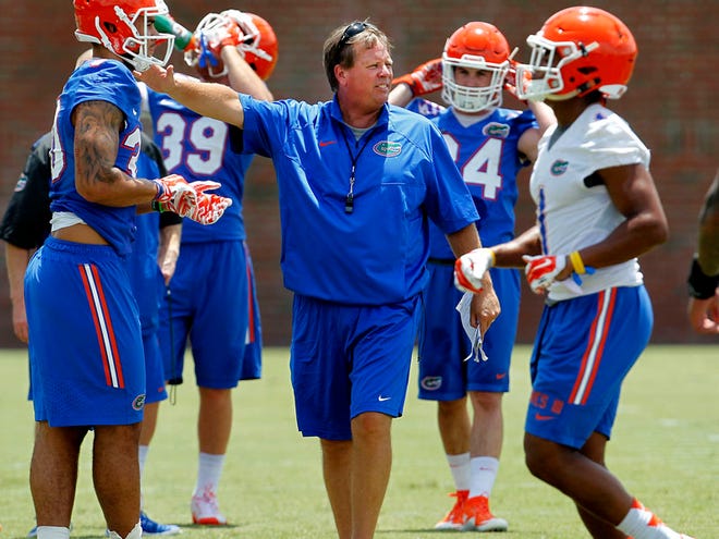 Head coach Jim McElwain instructs during the first day of football practice for the Florida Gators on Thursday, August 6, 2015 in Gainesville.