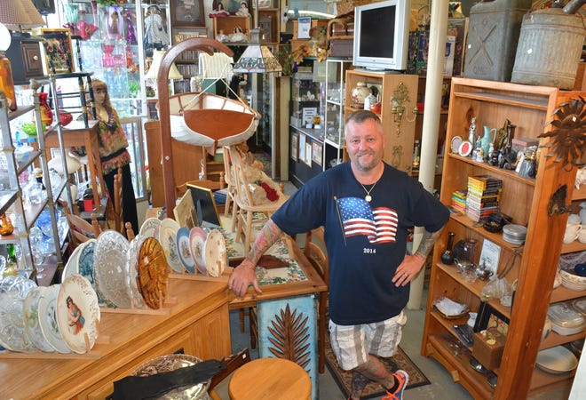 Joseph Altman-Beatham stands in the new location of his consignment shop, Silent Partners in Leominster. Photo/Chris Christo