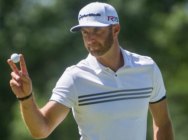 Dustin Johnson, seen Friday, grounded his club in a bunker on the 18th hole during the final round of the PGA Championship at Whistling Straits in 2010. He was penalized two shots for it, and his one-shot lead disappeared. Johnson missed out on a playoff. (Phil Long | Associated Press)