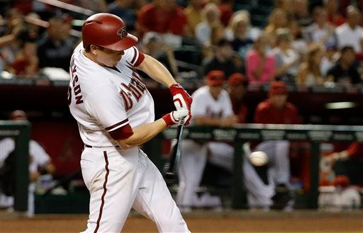 Arizona Diamondbacks' Jeremy Hellickson connects for a two-run single against the Philadelphia Phillies during the second inning of a baseball game Tuesday, Aug. 11, 2015, in Phoenix. (AP Photo/Ross D. Franklin)