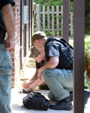 EDITORS NOTE: SHERIFF DECLINED TO IDENTIFY BOMB SQUAD MEMBERS: Montgomery County Sheriff?s Office Bomb & Hazardous Device Disposal Unit members work to disarm a device during an emergency training exercise at Arcadia University?s Crime Scene House in preparation for the Pope's visit to Philadelphia Wednesday August 12, 2015 in Cheltenham, Pennsylvania. (Photo by William Thomas Cain)