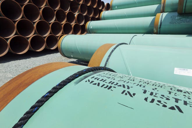 Some of 500 miles worth of coated steel pipe manufactured by Welspun Pipes, Inc., originally for the Keystone oil pipeline, stored in Little Rock, Ark. File Photo/The Associated Press