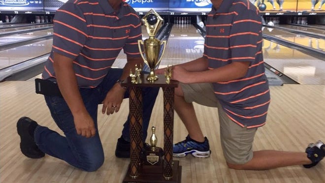 Jacob Boykin with his dad, Dr. Ian Boykin, after they won the All American Family US National Bowling Championships in Chicago. Photo by Cassie Boykin