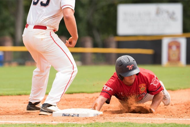 Medford, Ore.,, runner Micah Brown slides into third base for a triple in the seventh inning Thursday in the American Legion World Series against Brookilawn, N.J. Moments later Brown scored what would be the winning run in a 3-2 triumph.