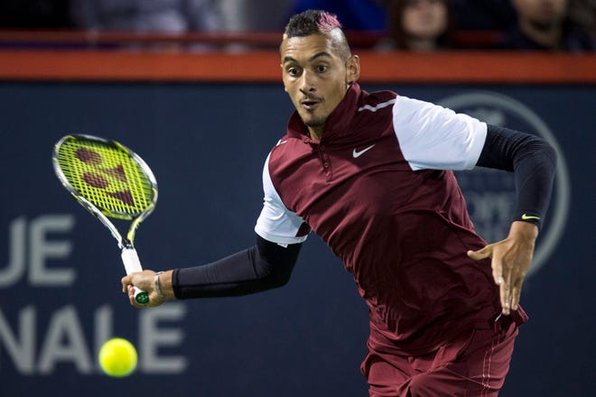Nick Kyrgios, of Australia, returns to Stan Wawrinka, of Switzerland, at the Rogers Cup tennis tournament Wednesday, Aug. 12, 2015, in Montreal.