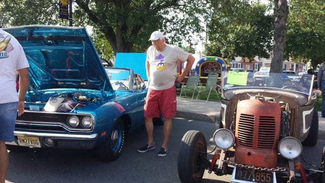 The show features three classes of cars — stock, modified, and antique.