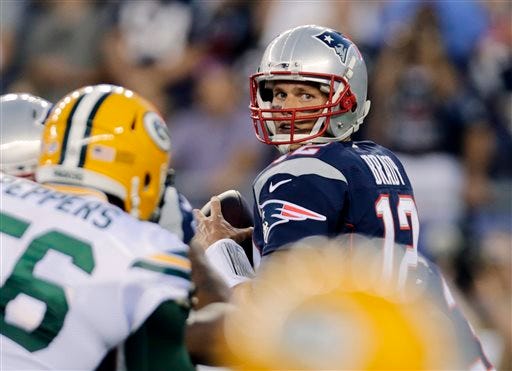 New England Patriots quarterback Tom Brady looks for a receiver during the first half of an NFL preseason football game against the Green Bay Packers, Thursday, Aug. 13, 2015, in Foxborough, Mass.