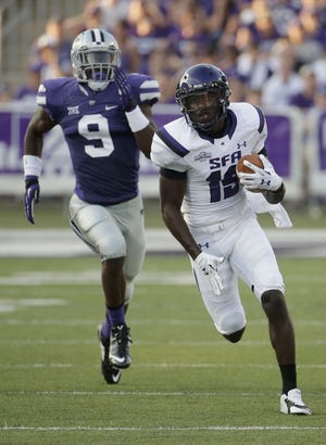 K-State’s Elijah Lee runs down a Stephen F. Austin receiver in last year’s opener. Lee played in all 13 games and his 4 1 / 2 ? sacks were most by a true freshman in school history.