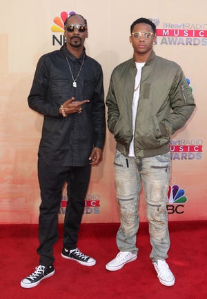 Snoop Dogg, left, and Cordell Broadus arrive at the iHeartRadio Music Awards at The Shrine Auditorium on Sunday, March 29, 2015, in Los Angeles.