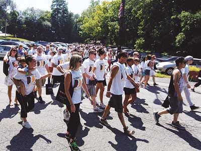 Photo by Tracy Klimek/New Jersey Herald Some of the more than 200 supporters start the 1.5-mile route of the Changing the Face of Addiction Walk on Saturday in Franklin, in memory of George Tizzano and Eric Burns, who each died because of addiction.