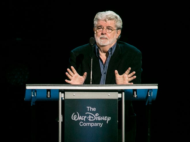 "Star Wars" creator, filmmaker George Lucas is honored with the Disney Legends Award, Friday, Aug. 14, 2015, in Anaheim, Calif. Lucas sold his company, and his iconic "Star Wars" film franchise, to Disney for $4 billion.