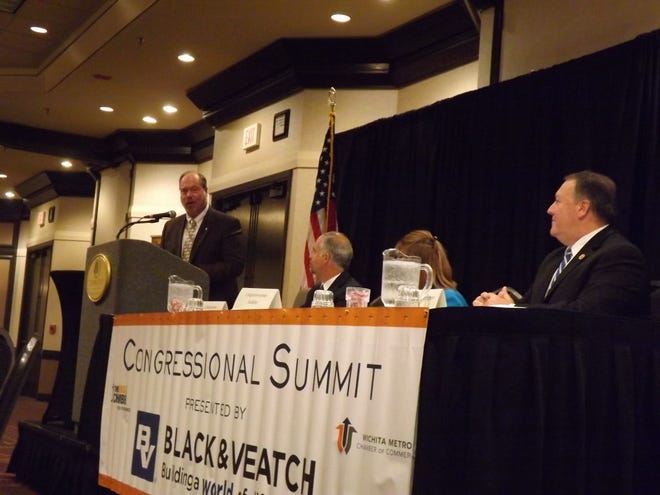 Paul Weida (from left) of the engineering firm Black & Vetach asks questions to U.S. Reps. Tim Huelskamp, Lynn Jenkins and Mike Pompeo during a Kansas Chamber summit Friday in Wichita.