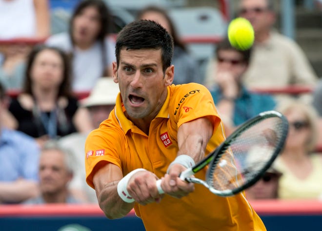 Novak Djokovic, of Serbia, returns to Jeremy Chardy, of France, during the semifinals at the Rogers Cup tennis tournament on Saturday, Aug. 15, 2015 in Montreal. Djokovic won 6-4, 6-4 to move on to the final.
