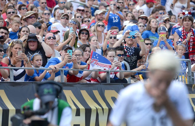 Fans cheer and take pictures of U.S. midfielder Megan Rapinoe on Sunday.