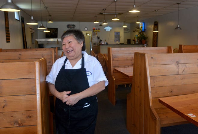 Lock Pharathikoune, a transplant resident of Jetmore from Laos who moved in 1979, laughs in her restaurant offering fresh thai food in downtown Jetmore on July 21, 2015.