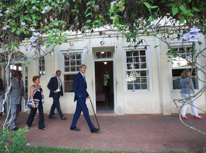 U.S. Secretary of State John Kerry walks at the "Finca Vijia," the former home of late U.S. writer Ernest Hemingway, now a museum in San Francisco de Paula, east of Havana, Cuba, Friday, Aug. 14, 2015. Earlier in the day, Kerry attended a ceremony that saw the reopening of the U.S. Embassy after a half-century of often-hostile relations. (AP Photo/Ismael Francisco, Cubadebate)