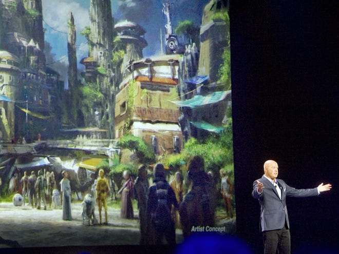 Concept art of the newly announced Star Wars Land at the D23 Expo in Anaheim, Calif., on Saturday. Bob Chapek, chairman of Walt Disney Parks and Resorts, said that all the employees would be dressed as if they are characters in the Star Wars universe. (Mindy Schauer/The Orange County Register via AP)