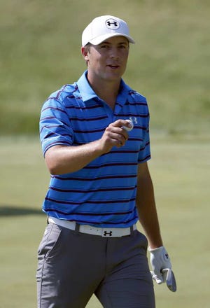 Jordan Spieth reacts after making a birdie on the 18th hole during the second round of the PGA Championship golf tournament Friday, Aug. 14, 2015, at Whistling Straits in Haven, Wis. (AP Photo/Julio Cortez)
