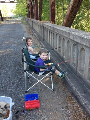 Brothers Harley and Logan Averette are shown here during a family fishing outing in May 2014.