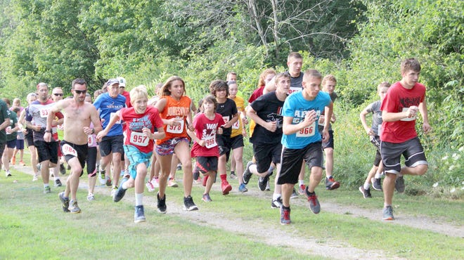 Runners take off from the start line at the Litchfield 5K. There were 62 participants. MATTHEW LOUNSBERRY PHOTO