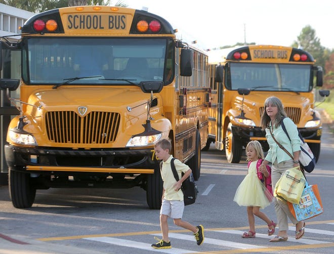 Students are taken to class at Patronis Elementary School in Panama City Beach in 2014. Aug. 18 is the first day of school for Bay District students.