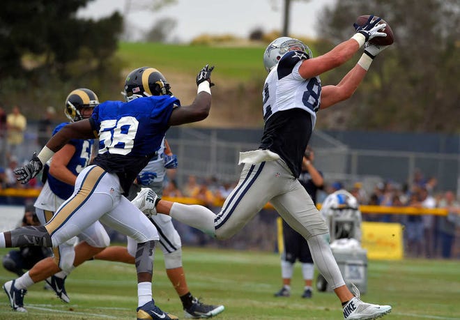 Dallas Cowboys tight end Jason Witten, right, makes a catch over the defense of St. Louis Rams outside linebacker Jo-Lonn Dunbar during a joint NFL football training camp, Monday, Aug. 17, 2015, in Oxnard, Calif. (AP Photo/Mark J. Terrill)