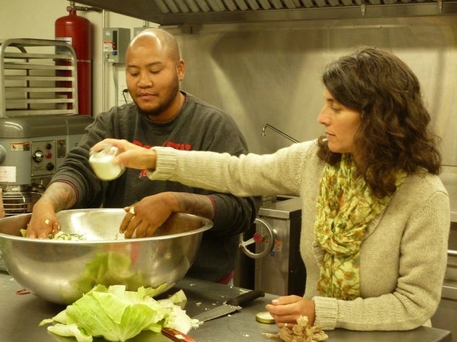 Shaun Van Laarhoven and Liz Wiley lead a fermentation workshop at the Grange Kitchen in 2014. The Round the Bend Farm workers will lead more workshops in August and September. SUBMITTED