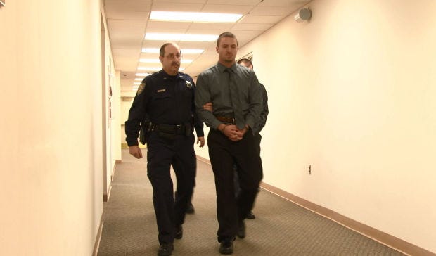 Defendants Beau Chermer, foreground, and Joseph Arlott are led to a courtroom in the Beaver County Courthouse before the start of a hearing Jan. 30, 2014. Chermer and Arlott are accused of killing Hopewell Township resident Daniel Santia.