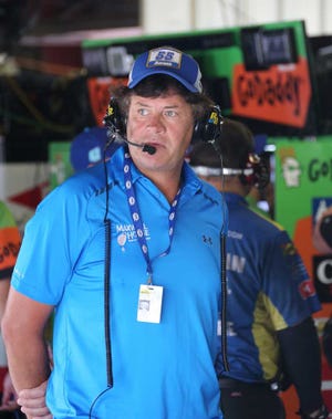Bob Brodbeck Associated Press Michael Waltrip stands inside his garage before a Sprint Cup Series practice session last Friday at Michigan International Speedway in Brooklyn, Mich.