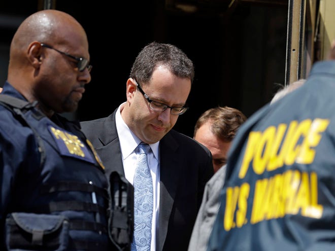 Former Subway pitchman Jared Fogle leaves the Federal Courthouse in Indianapolis, Wednesday, Aug. 19, 2015 following a hearing on child-pornography charges. Fogle agreed to plead guilty to allegations that he paid for sex acts with minors and received child pornography in a case that destroyed his career at the sandwich-shop chain and could send him to prison for more than a decade. (AP Photo/Michael Conroy)