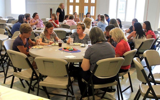Teachers enjoy a free lunch Tuesday at First United Methodist Church in Havelock. The church's women's group provided the lunch to educators as a sign of appreciation.