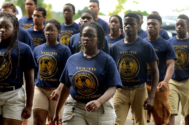 Cadets in Willingboro Youth Police Academy go through their military drill outside the Kennedy Center on Thursday, August 20, 2015.