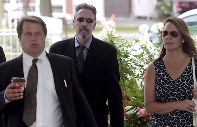 Michael Ware (center) enters Wayne County Courthouse in Honesdale, Pennsylvania, for sentencing Thursday, Aug. 20, 2015.