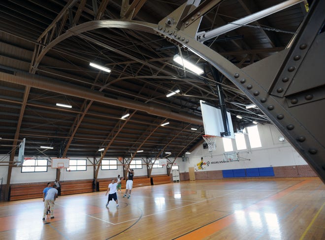 Men play basketball at Albert Kirkland Sr. Gymnasium in Lake Wales. The gym was built in the 1930s and renovated in the 1990s.