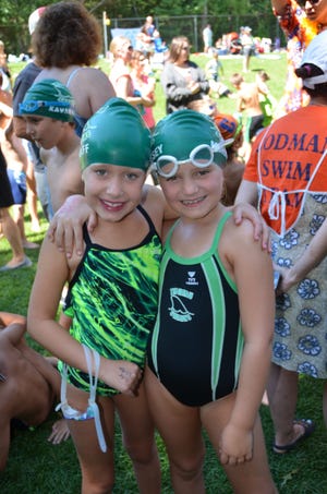 Thoreau Sharks eight and under's Colby Graff and Teagan Morrissey are all smiles as they get ready for their races at the Sudbury Swim & Tennis swim championships held Aug. 8. COURTESY PHOTO/ BONNIE MCALLEY