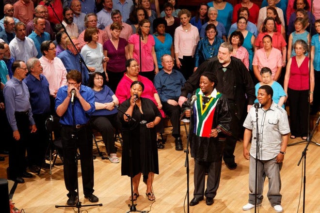 South African guests sing at Mystic Chorale’s 20th anniversary concert.