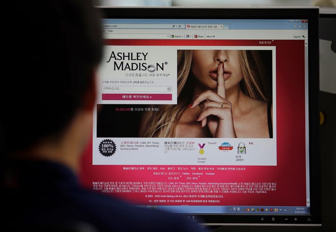 FILE - A June 10, 2015 photo from files showing Ashley Madison's Korean web site on a computer screen in Seoul, South Korea. U.S. government employees with sensitive jobs in national security or law enforcement were among hundreds of federal workers found to be using government networks to access and pay membership fees to the cheating website Ashley Madison, The Associated Press has learned. The list includes at least two assistant U.S. attorneys, an information technology administrator in the White House's support staff, a Justice Department investigator, a division chief, and a government hacker and counterterrorism employee at the Homeland Security Department. Others visited from networks operated by the Pentagon. (AP Photo/Lee Jin-man, File)