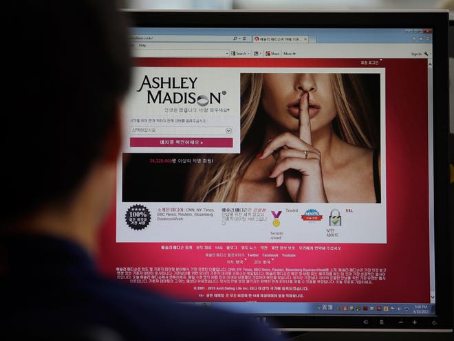 A June 10, 2015 photo from files showing Ashley Madison's Korean web site on a computer screen in Seoul, South Korea. U.S. government employees with sensitive jobs in national security or law enforcement were among hundreds of federal workers found to be using government networks to access and pay membership fees to the cheating website Ashley Madison, The Associated Press has learned. The list includes at least two assistant U.S. attorneys, an information technology administrator in the White House's support staff, a Justice Department investigator, a division chief, and a government hacker and counterterrorism employee at the Homeland Security Department.