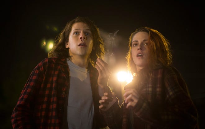 Mike (Jesse Eisenberg) and Phoebe (Kristen Stewart) can’t believe what’s coming after them.