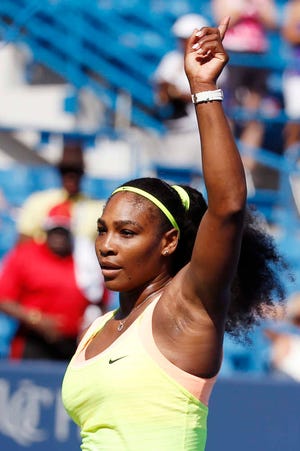 Serena Williams, of the United States, waves to the crowd after defeating Karin Knapp, of Italy, at the Western & Southern Open tennis tournament, Thursday, Aug. 20, 2015, in Mason, Ohio. (AP Photo/John Minchillo)