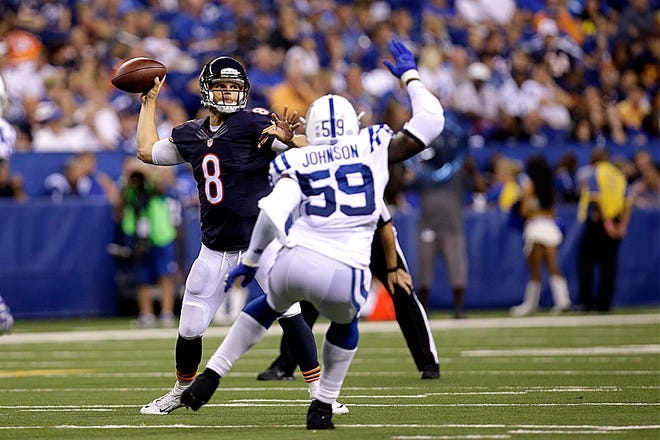 Chicago Bears quarterback Jimmy Clausen throws over Indianapolis Colts linebacker Cam Johnson in the second half of a preseason game Saturday in Indianapolis.