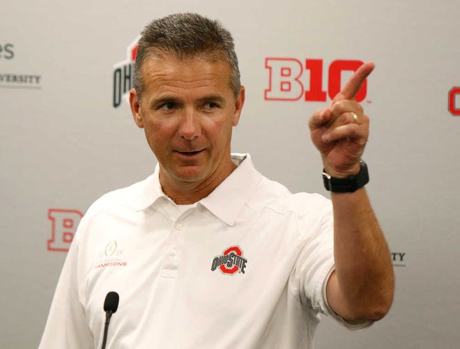 FILE - In this Aug. 16, 2015, file photo, Ohio State coach Urban Meyer speaks to reporters during the university's NCAA college football media day in Columbus, Ohio. Since taking over at Ohio State, Meyer has insisted he is a changed man, just as intense but better able to enjoy success. This season, will put Meyer's new outlook to the test. (AP Photo/Paul Vernon, File)