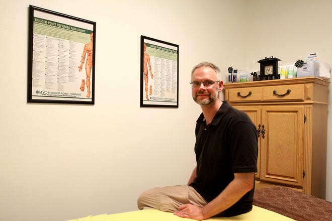 Scott Gould of Hand Over Hand Massage & Wellness in Loves Park is living his dream of being a small business owner. JANE LETHLEAN/RRSTAR.COM