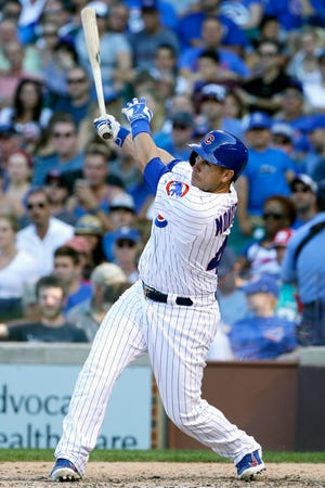 Chicago Cubs' Miguel Montero hits a solo home run during the eighth inning of a baseball game against the Atlanta Braves, Saturday, Aug. 22, 2015, in Chicago. (AP Photo/Nam Y. Huh)