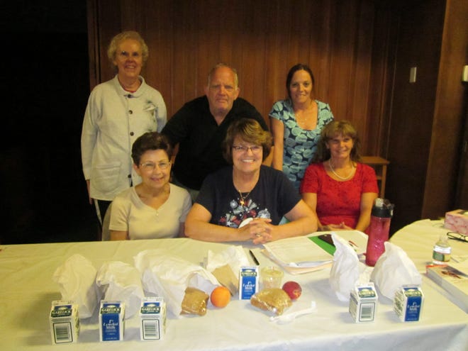 It takes a lot of people to put together a successful Summer Lunch Program and these are some of the volunteers who are on hand five days a week at Holy Trinity to serve the meals. Front row from left: Judith Richards, Kathleen Demers and Sandra Quintin; and back row, from left, Diane Byrne, Bob Recko and Diane Place. WICKED LOCAL PHOTO/ MARY WENZEL