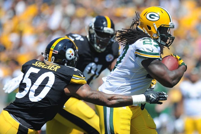 Green Bay Packers running back Eddie Lacy (27) runs past Pittsburgh Steelers inside linebacker Ryan Shazier (50) in the first quarter of the pre-seaon NFL football game against the Pittsburgh Steelers, Sunday, Aug. 23, 2015 in Pittsburgh.