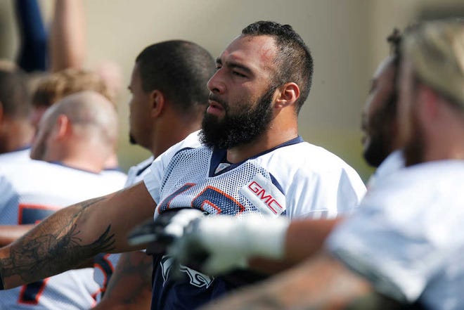 Denver Broncos tackle Louis Vasquez (65) drills at the team's training camp on Aug. 7 in Englewood, Colorado.